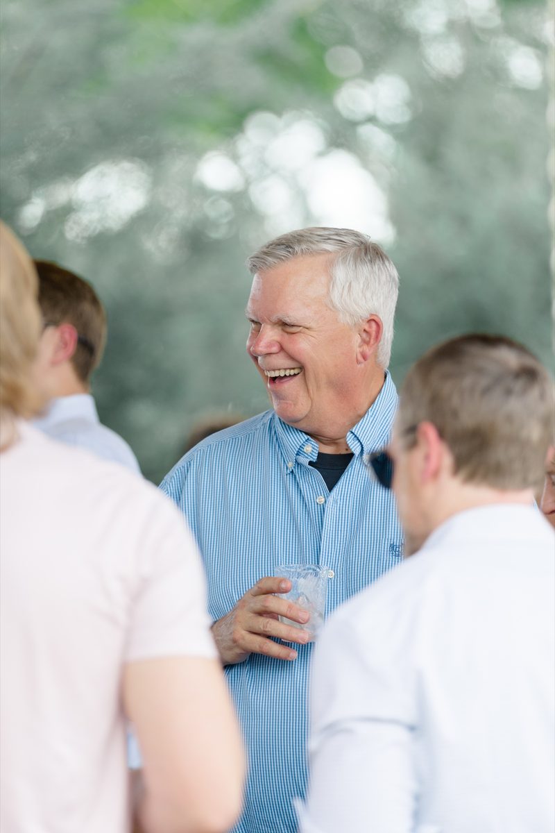 Wedding guest laughing during cocktail hour